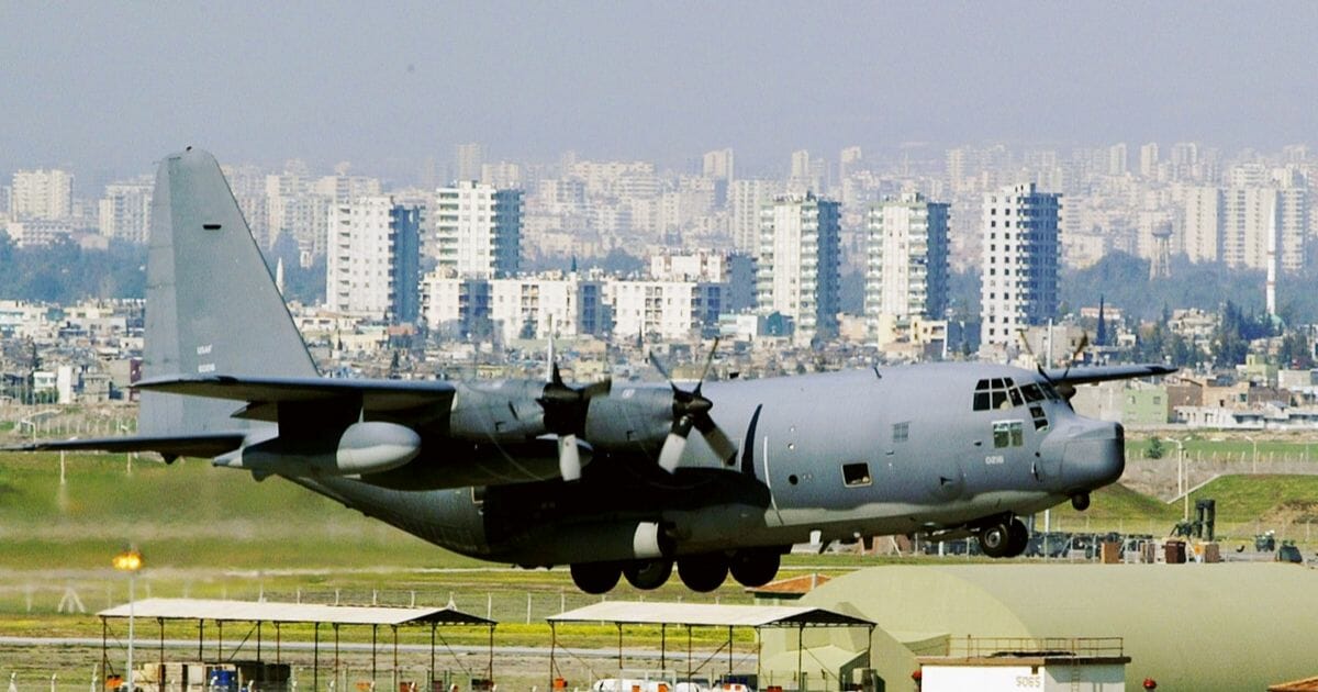 A C-130 glides in for a landing in front of downtown Adana at Incirlik Air Force Base in Turkey.