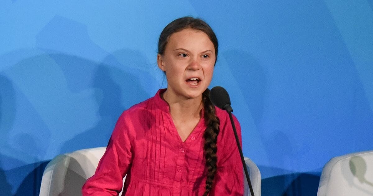 Greta Thunberg giving a speech at the UN.