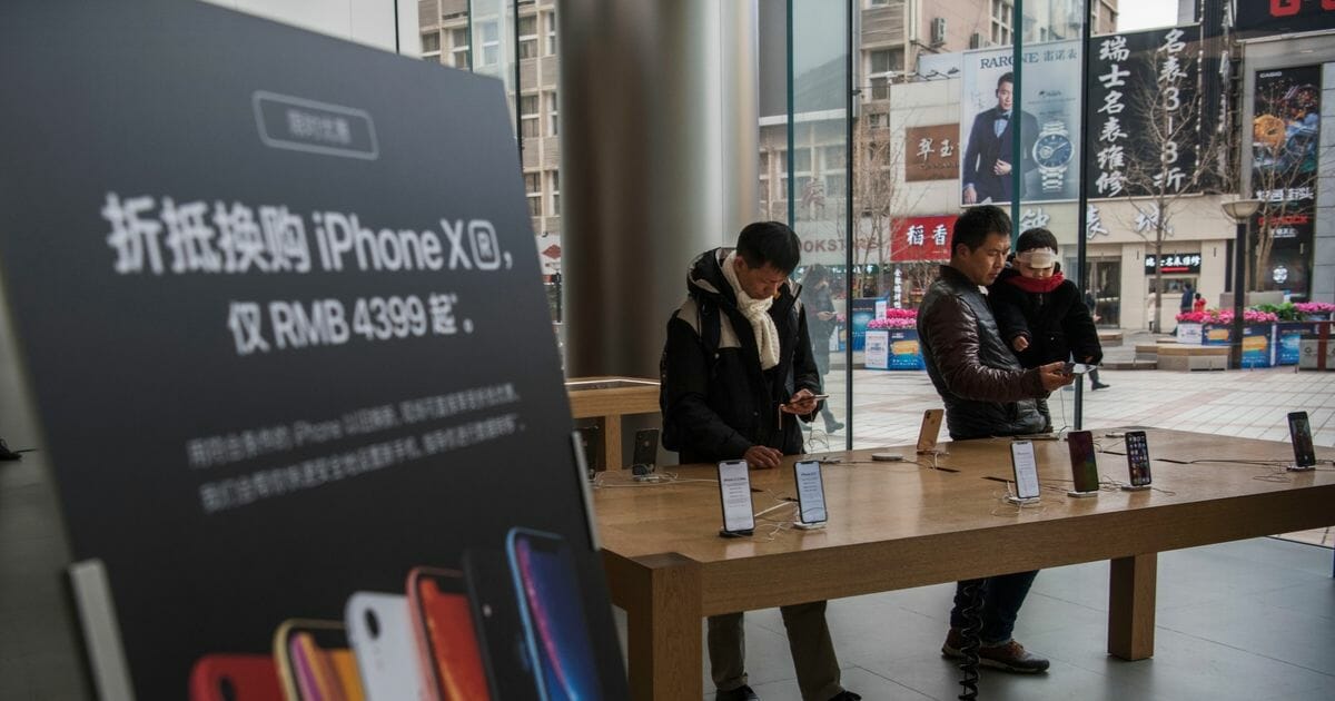 Chinese customers browse at a Chinese Apple store.