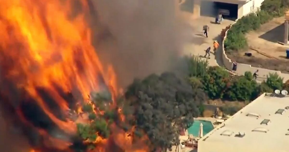 Residents flee from a California wildfire.