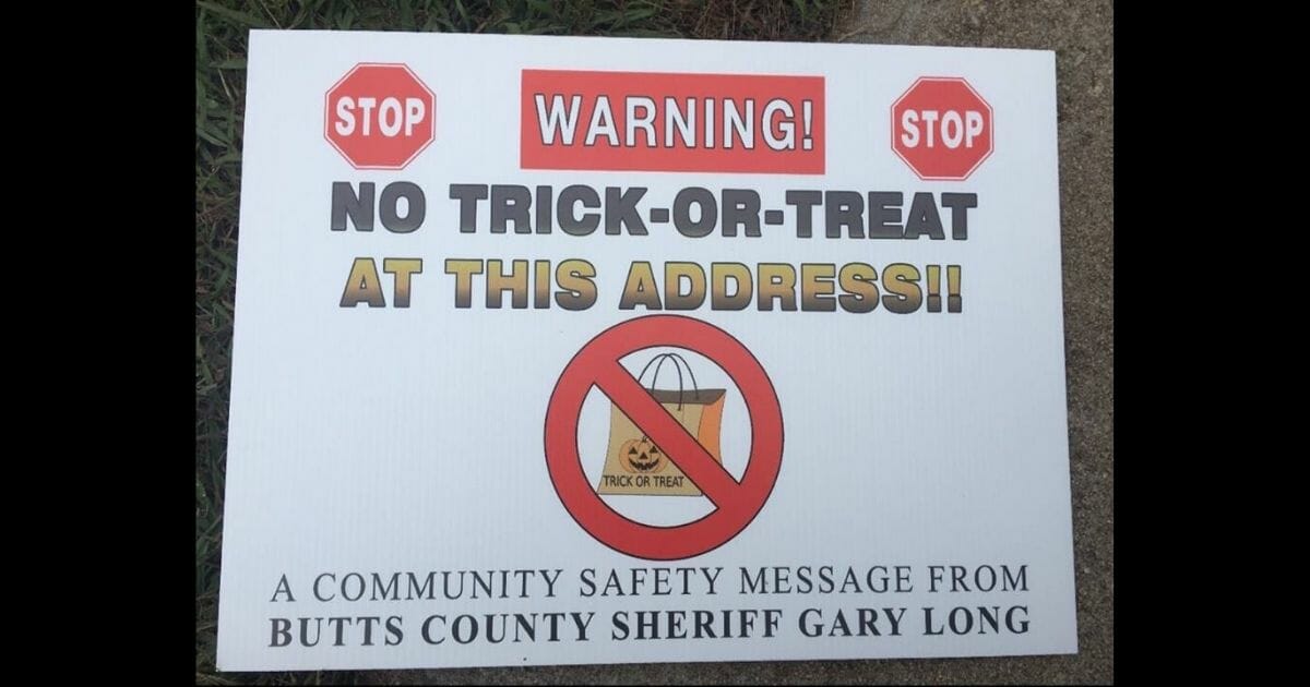 A warning sign posted to Butts County sex offenders' doors.