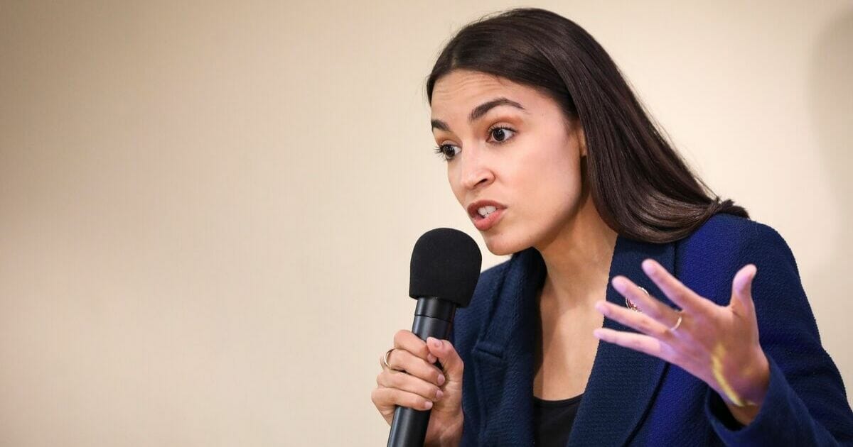 U.S. Rep. Alexandria Ocasio-Cortez speaks during a town hall meeting Thursday at the LeFrak City Queens Library in New York City.