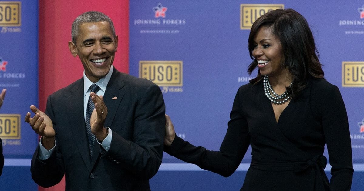 Then-President Barack Obama and first lady Michelle Obama laugh during a United Services Organization anniversary event at Joint Base Andrews, Maryland, in 2016. Since leaving the White House, the Obamas have taken the plunge deep into the entertainment industry, and were just named to The Hollywood Reporter's list of 100 most powerful people in Hollywood.