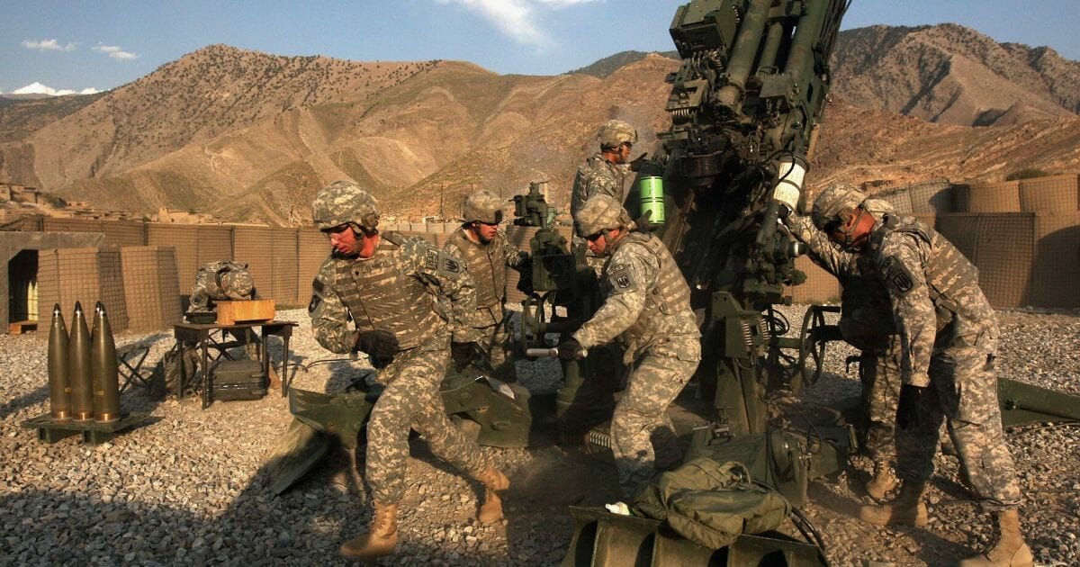 U.S. artillerymen prepare to fire a 155mm howitzer at Taliban positions in October 2008 in the Kunar Province of eastern Afghanistan.