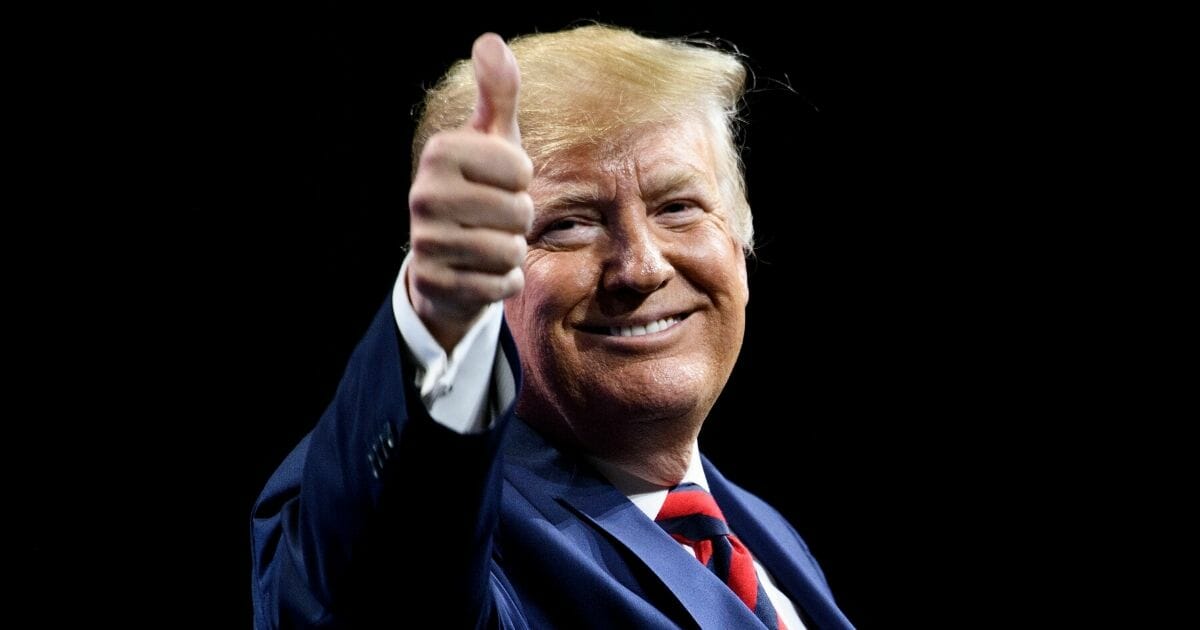 President Donald Trump gestures during the International Association of Chiefs of Police Annual Conference in Chicago on Monday.