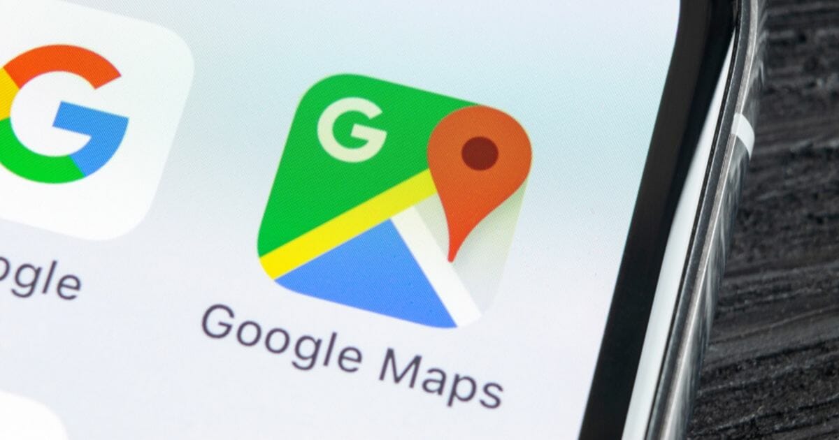 The Google Maps application icon on an Apple iPhone X screen close-up.