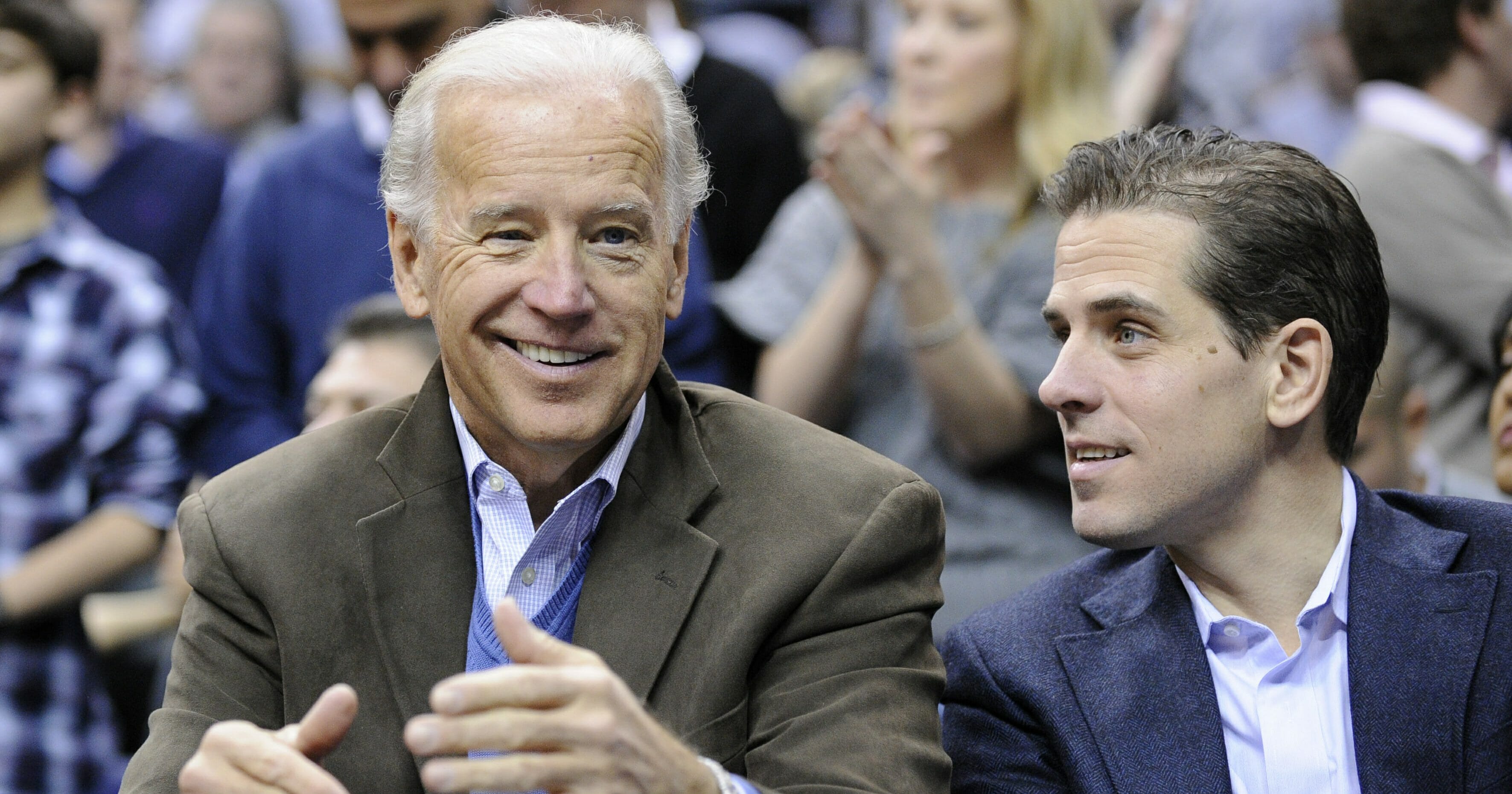Then-Vice President Joe Biden attends an NCAA basketball game with his son Hunter, right, on Jan. 30, 2010, in Washington.