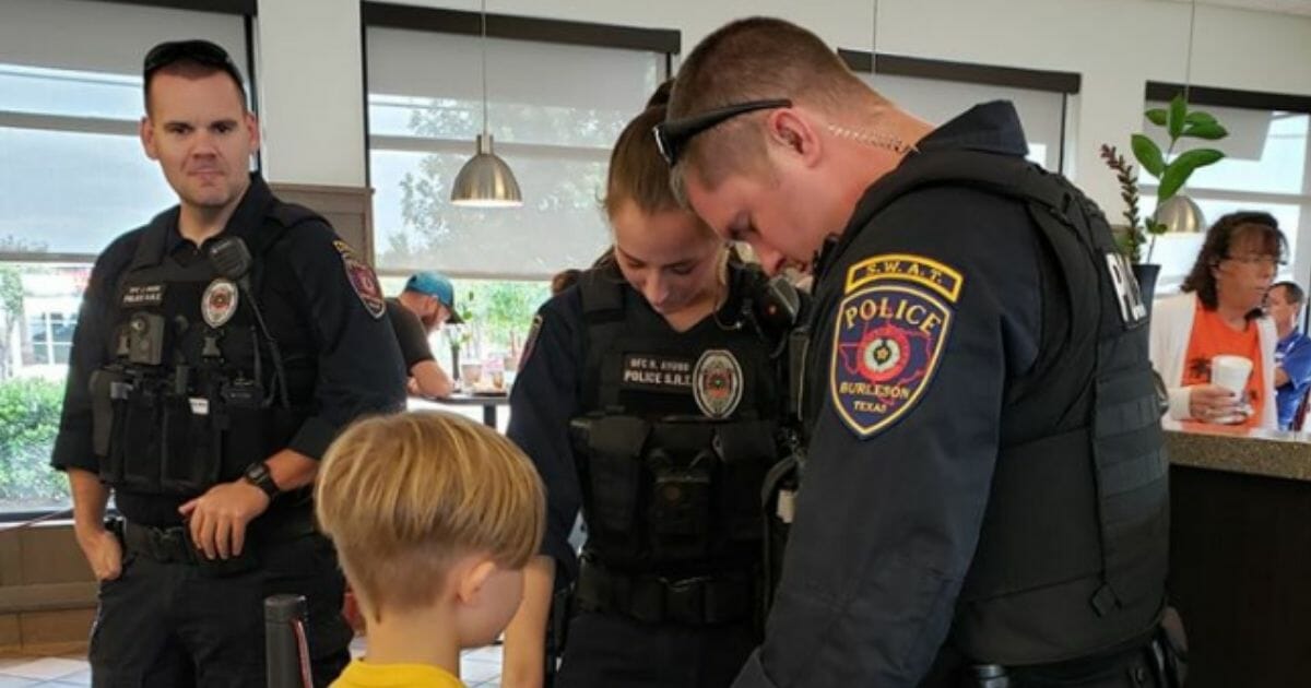 Little boy from Texas prays for police officers in a Chick-fil-A.