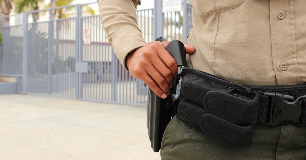 A policeman at a high school in California. On Oct. 15, a freshman brought a gun to La Habra High School but was tackled by several classmates.