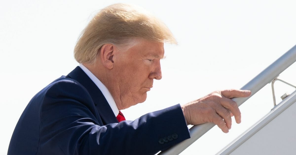 President Donald Trump walks to board Air Force One prior to departure from John F. Kennedy International Airport in New York, Sept. 26, 2019.