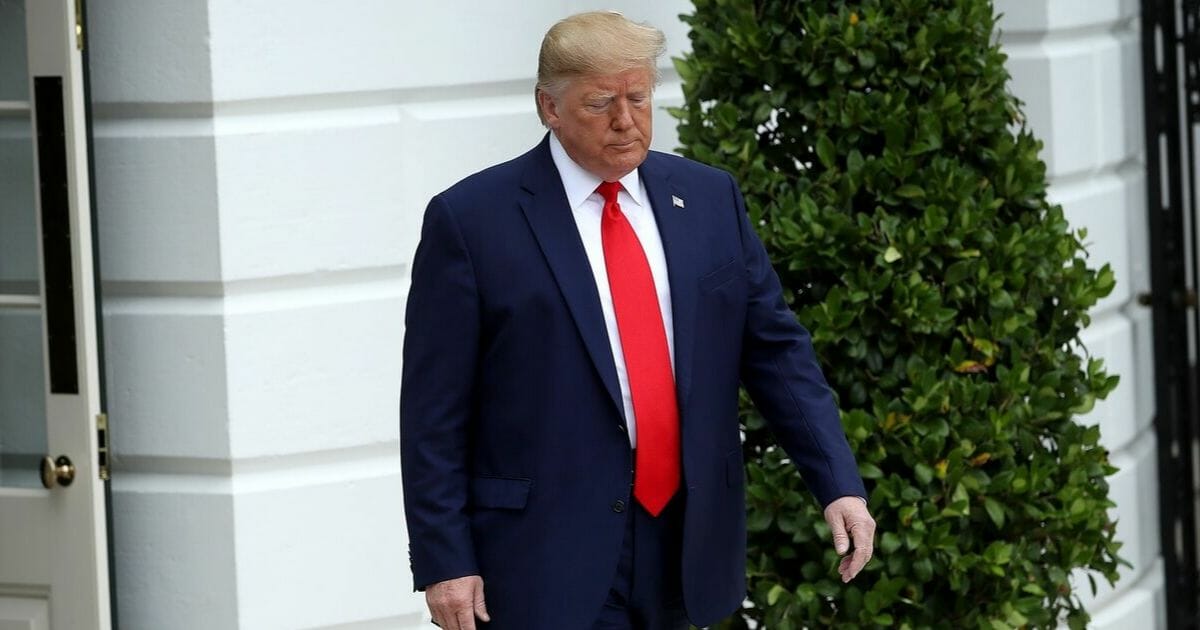 President Donald Trump walks out of the White House to answer questions while departing the White House on Oct. 03, 2019 in Washington, D.C.