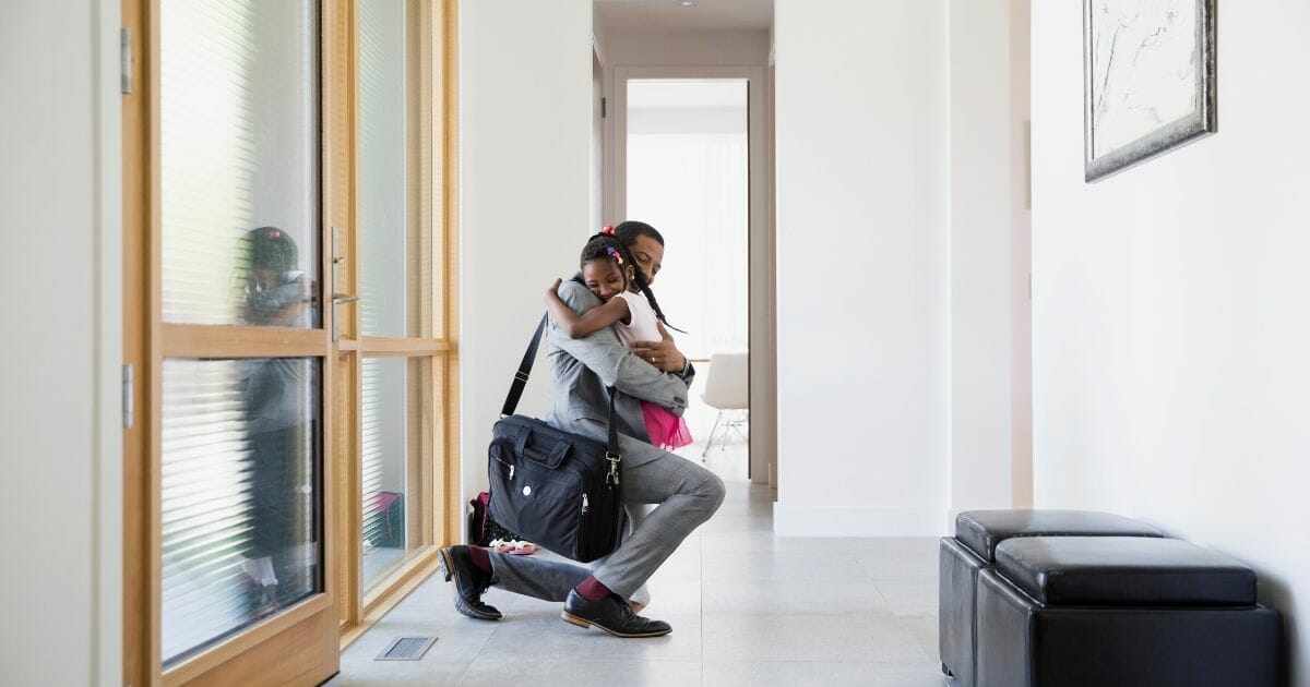 Father hugging daughter