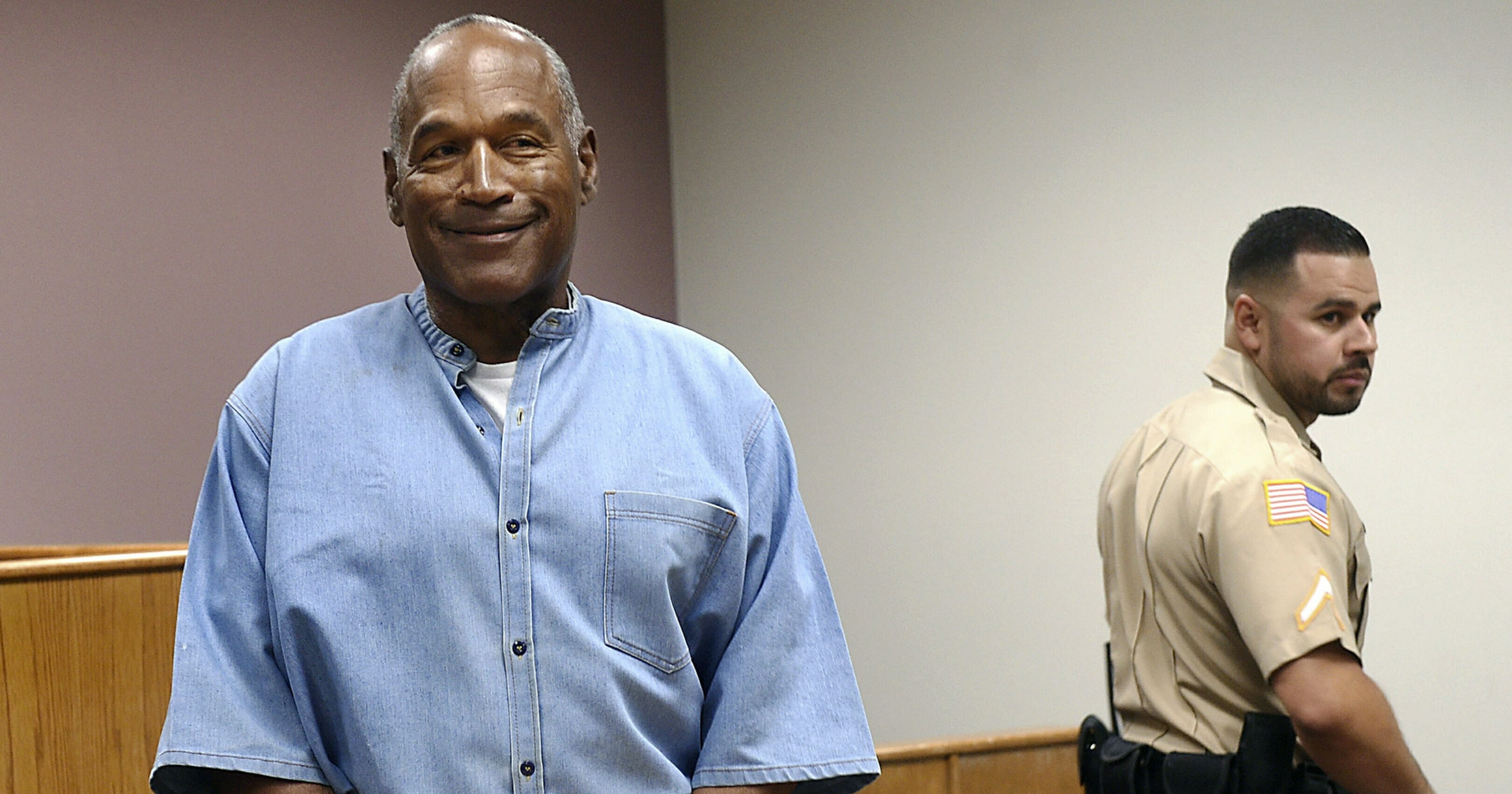 In this July 20, 2017, file photo, former NFL football star O.J. Simpson enters his parole hearing at the Lovelock Correctional Center in Lovelock, Nevada. Simpson is suing a Las Vegas hotel-casino, alleging unnamed employees defamed him by telling celebrity news site TMZ he was ordered off the property in 2017 for being drunk, disruptive and unruly.