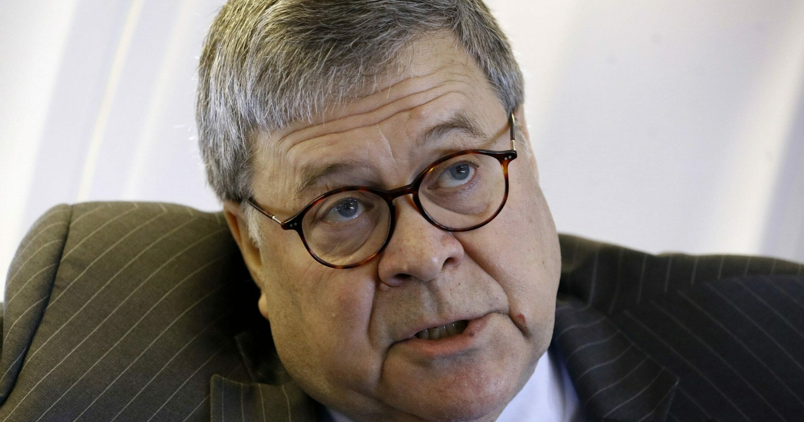 Attorney General William Barr speaks with an Associated Press reporter onboard an aircraft en route to Cleveland on Nov. 21, 2019, during a two-day trip to Ohio and Montana.