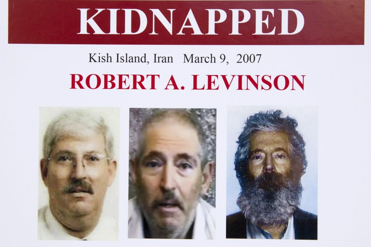 In this March 6, 2012, file photo, an FBI poster showing a composite image of former FBI agent Robert Levinson, right, of how he would look like now after five years in captivity, and an image, center, taken from the video, released by his kidnappers, and a picture before he was kidnapped, left, displayed during a news conference in Washington.