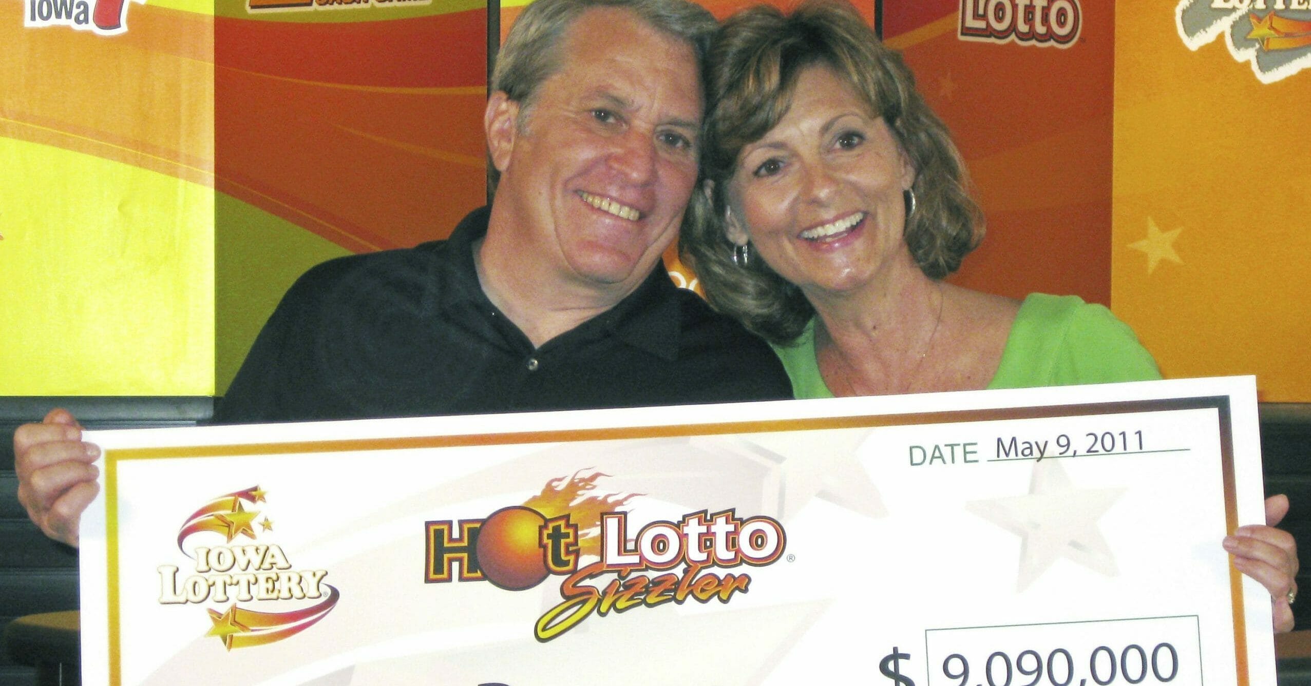 This May 9, 2011, photo shows Larry Dawson and his wife, Kathy, claiming their $9.09 million Hot Lotto jackpot in Des Moines, Iowa.