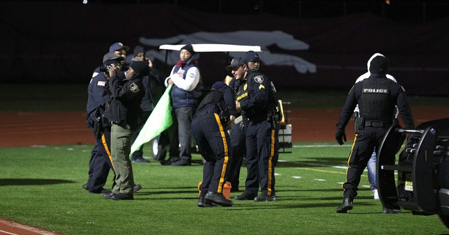Police investigate the scene after a gunman shot into a crowd of people during a football game at Pleasantville High School in Pleasantville, New Jersey, on Nov. 15, 2019.
