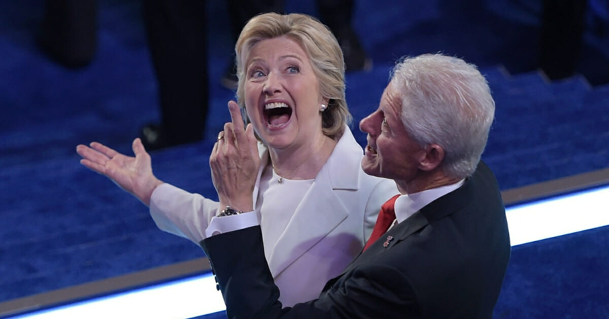 Then-Democratic presidential candidate Hillary Clinton and her husband, former President Bill Clinton, look at the balloons at the end of the Democratic National Convention at the Wells Fargo Center in Philadelphia on July 28, 2016.