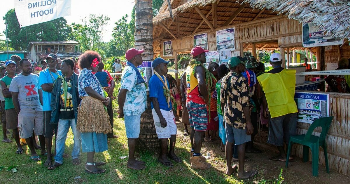 People line up to vote at a polling station in the capital Buka in an historical independence vote on Nov. 25, 2019.