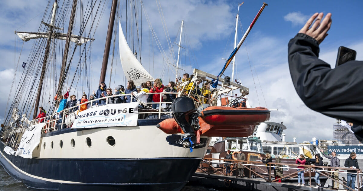 An international group of young people who were set to participate in a U.N. climate summit in Chile, is waved goodbye in Amsterdam on Oct. 2, 2019, upon their departure on a sailing ship to take part in the event.