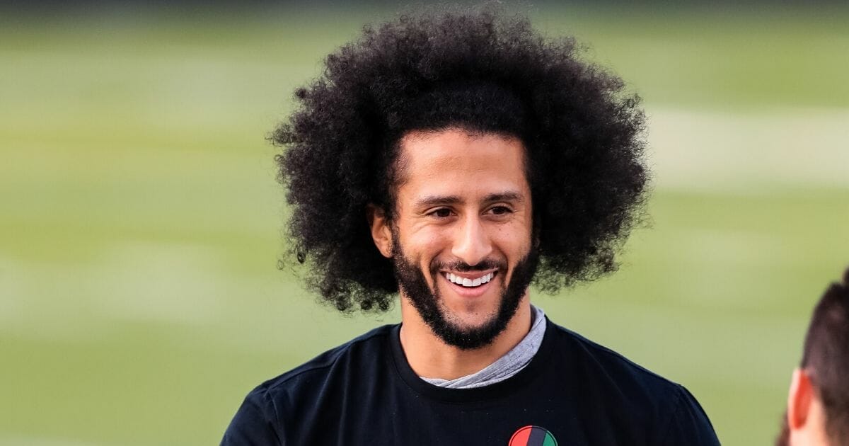 Colin Kaepernick looks on during his NFL workout held at Charles R Drew high school on Nov. 16, 2019, in Riverdale, Georgia.