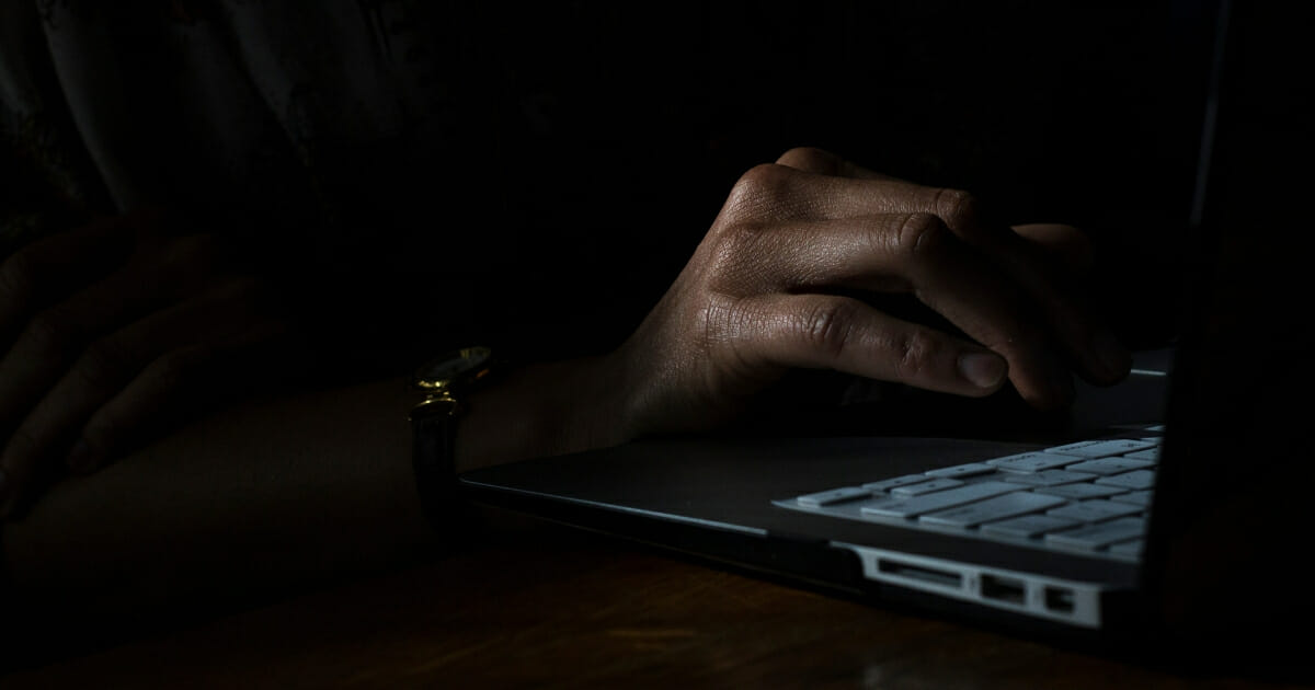 Pornhub has been getting a lot of credit as of late for an advertising campaign which highlights plastic in the ocean. This is what they don't publicize. The image above is a stock photo of a person using a computer in a dark room.