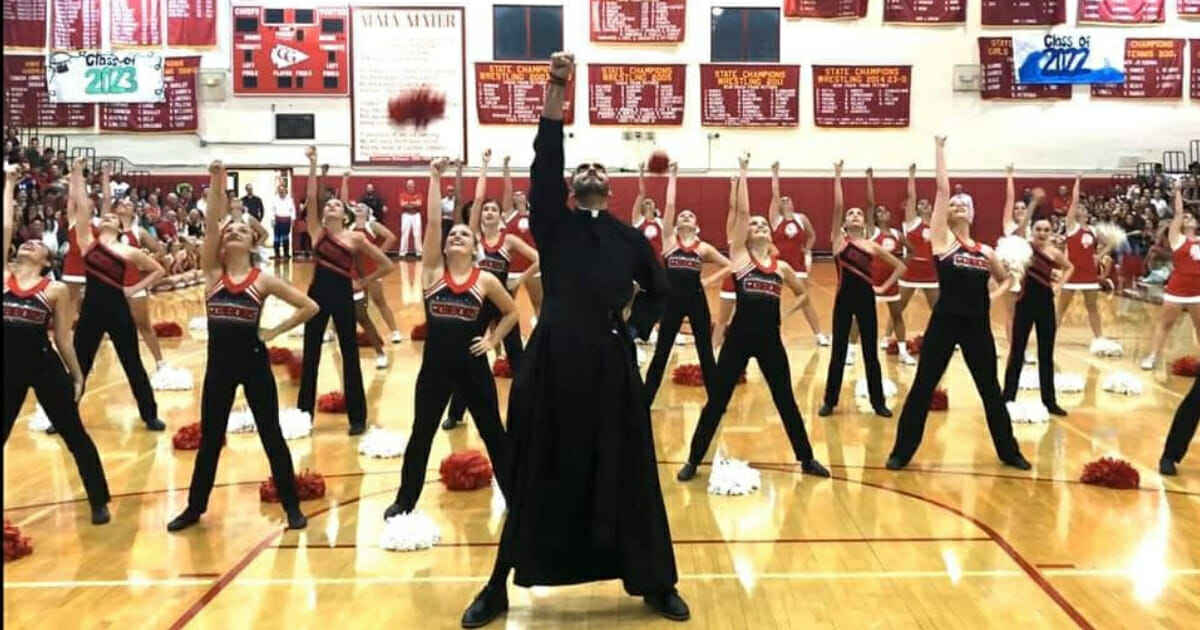 A priest at a Catholic high school in Florida surprised students when he jumped on the court to join the dance team last month.