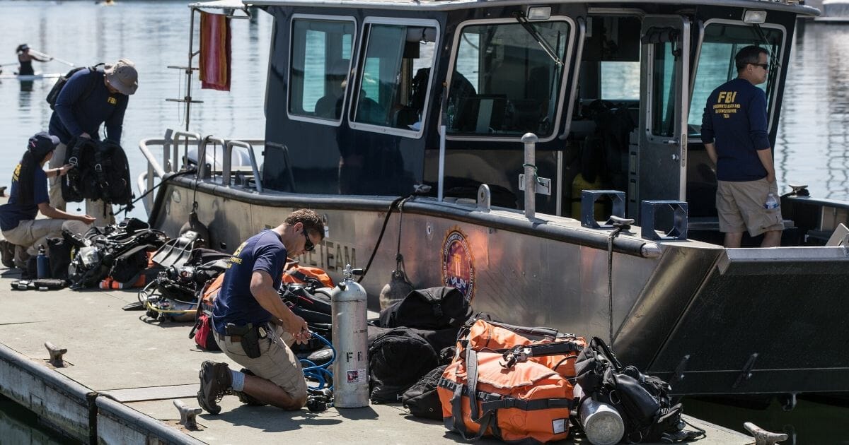 Members of the FBI's Underwater Search and Evidence Response Team prepare to recover the final body from the dive boat Conception on Sept. 5, 2019, in Santa Barbara, California. Thirty-four people died aboard the dive boat Conception when it caught fire offshore at Santa Cruz Island in the early morning hours of Labor Day.
