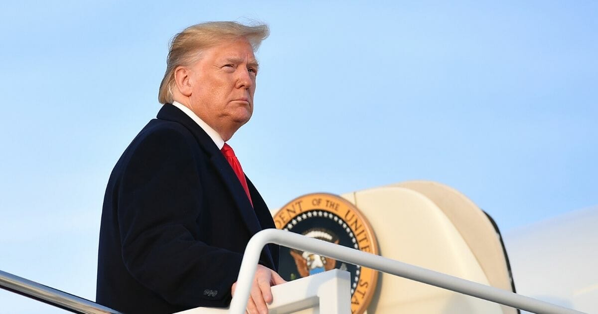 President Donald Trump makes his way to board Air Force One before departing from Andrews Air Force Base in Maryland on Nov. 4, 2019.