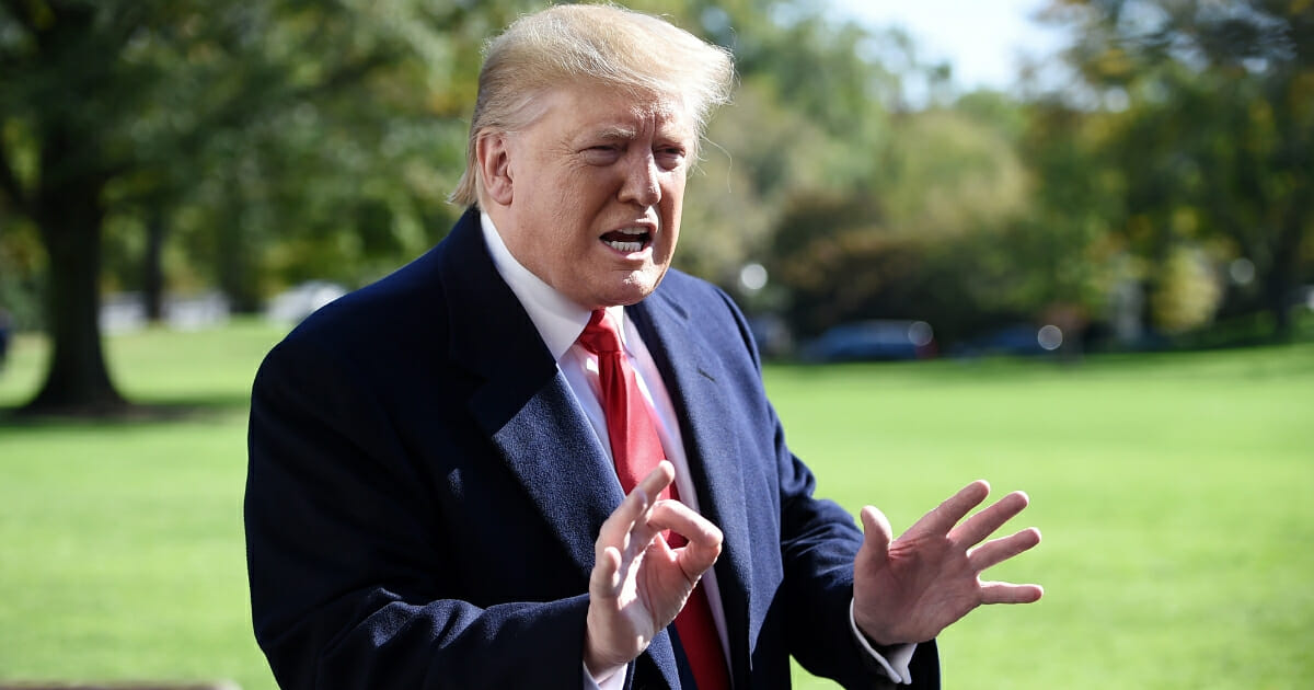 President Donald Trump talks to the media on the South Lawn upon his return to the White House in Washington, D.C., on Nov. 3, 2019.
