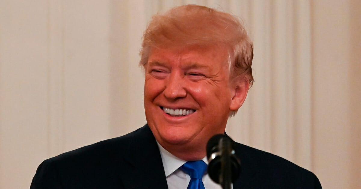 President Donald Trump smiles during an event at the White House on Nov. 21, 2019.