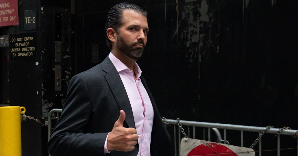 Donald Trump Jr., the eldest son of President Donald Trump, gives a thumbs-up as he walks outside of Trump Tower in New York on Sept. 24, 2019.