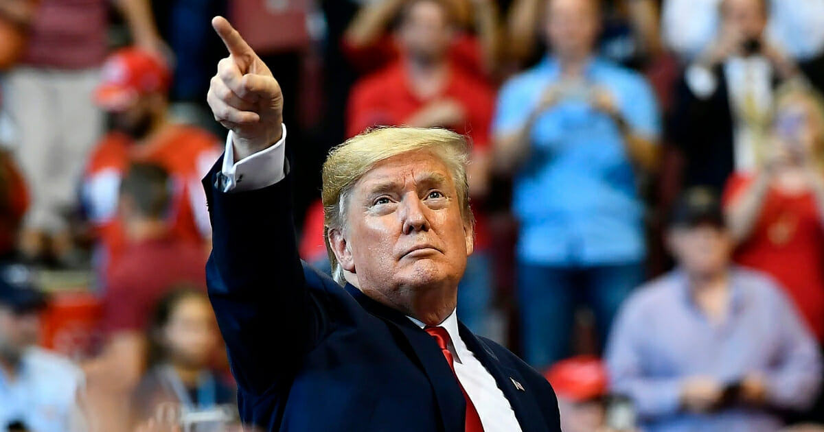 President Donald Trump points during a "Keep America Great" rally at the BB&T Center in Sunrise, Florida, on Nov. 26, 2019.