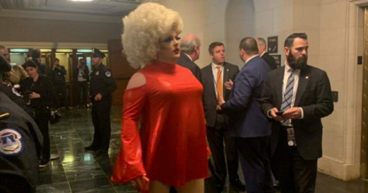 With the eyes of the political world on Washington, D.C., this week for the first public impeachment hearing, a drag queen who goes by the name "Pissi Myles" decided to take advantage.