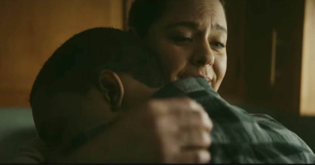 Mom hugging her adopted son