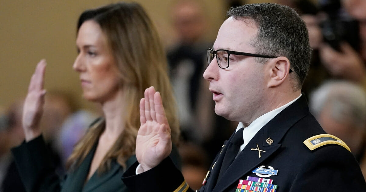 Lt. Col. Alexander Vindman, right, the National Security Council's director for European affairs, and Jennifer Williams, left, an adviser to Vice President Mike Pence for European and Russian affairs, are sworn in prior to testifying before the House Intelligence Committee in the Longworth House Office Building on Capitol Hill on Nov. 19, 2019, in Washington, D.C.