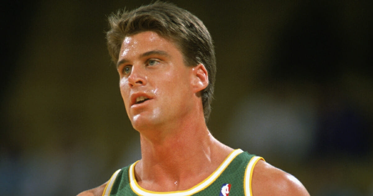 Jim Farmer #21 of the Seattle Supersonics looks on during a game in the 1989-1990 NBA season.