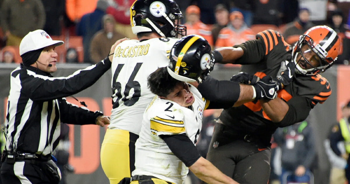 Cleveland Browns defensive end Myles Garrett hits Pittsburgh Steelers quarterback Mason Rudolph over the head with his helmet during a game Nov. 14, 2019, at FirstEnergy Stadium in Cleveland.