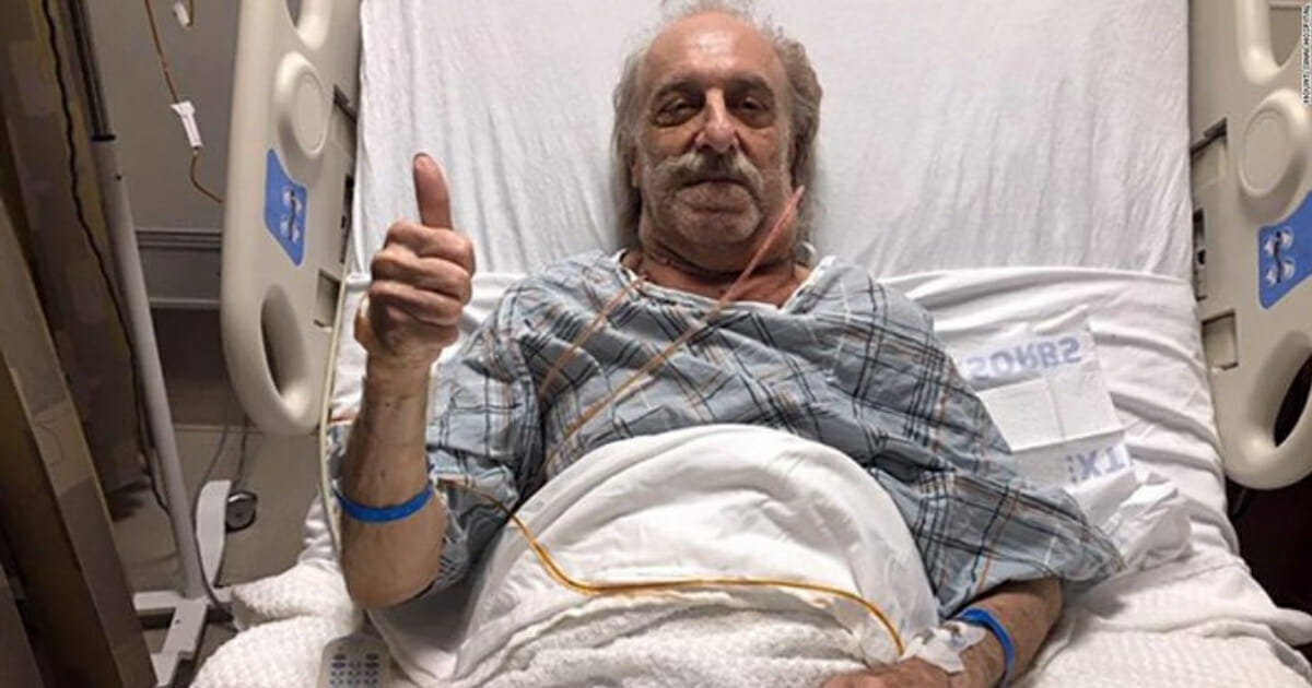 Milton Wingert, 81, of New Jersey gives a thumbs up after a tumor the size of a soccer ball was removed from his neck.