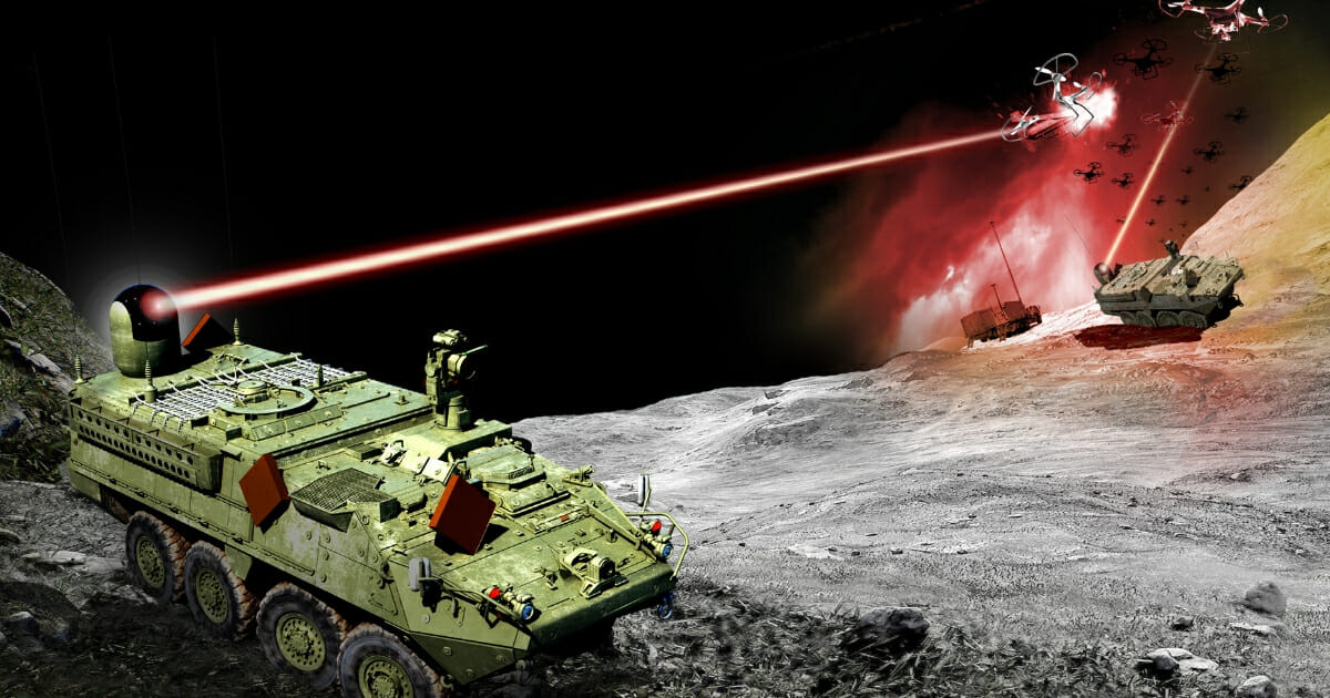An Army Stryker combat vehicle armed with a directed energy weapon fires upon a drone.