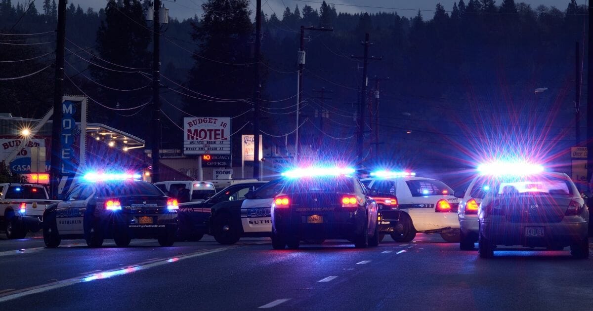 The image above shows police cars at a crime scene in Oregon in 2012.