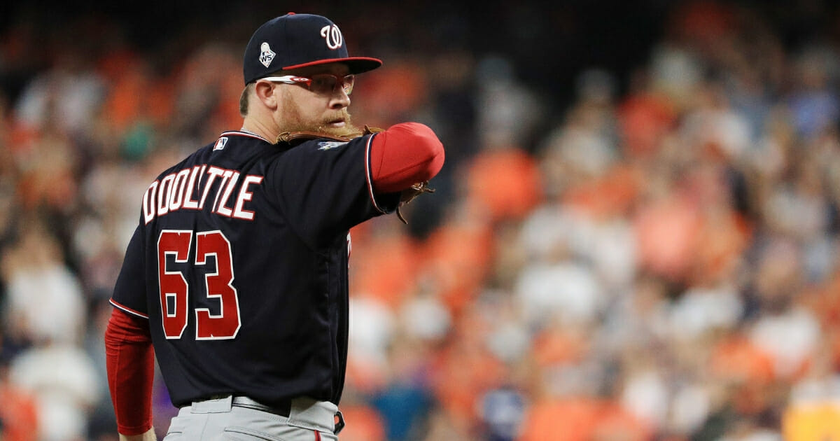 Sean Doolittle #63 of the Washington Nationals delivers a pitch against the Houston Astros during the ninth inning in Game 1 of the 2019 World Series at Minute Maid Park on Oct. 22, 2019, in Houston, Texas.