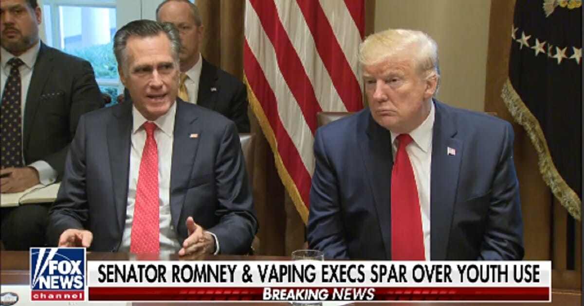 Utah Sen. Mitt Romney speaks next to President Donald Trump during a White House session on flavored vaping products.