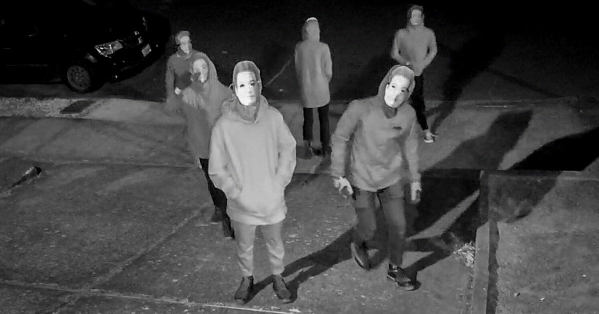 A group of masked people descends on a family home of journalist Andy Ngo.