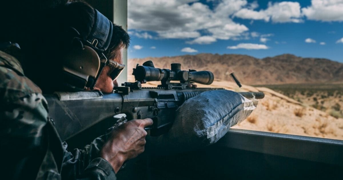 An Army Special Operations soldier with the 3rd Battalion, 7th Special Forces Group (Airborne) fires a M110 Semi-Automatic Sniper System during a training exercise at the Marine Corps Air-Ground Combat Center Twentynine Palms.