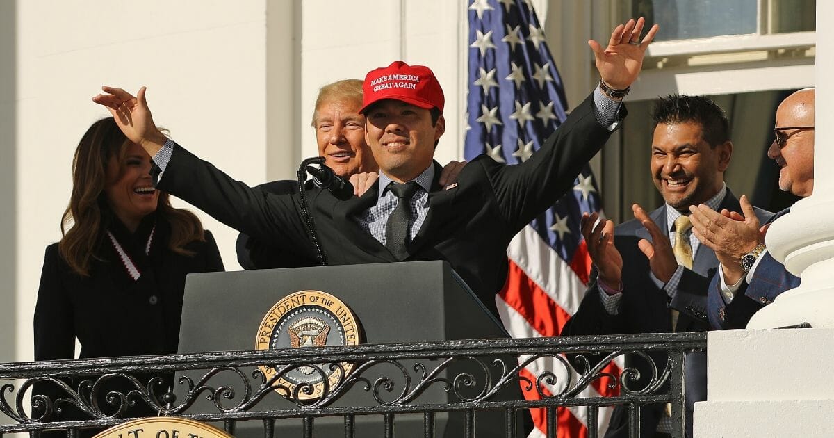 Nationals catcher Kurt Suzuki wearing a "Make America Great Again" cap with President Donald Trump outside the White House on Monday.