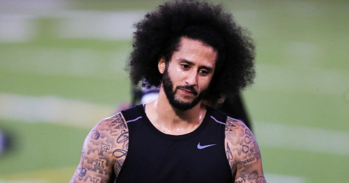 Former San Francisco 49ers quarterback Colin Kaepernick takes a breather during his workout for NFL teams Nov. 16 outside Atlanta.