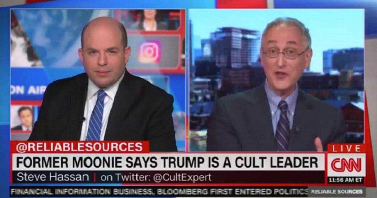 CNN host Brian Stelter, left, interviews former Moonie Steven Hassan on Sunday on "Reliable Sources."