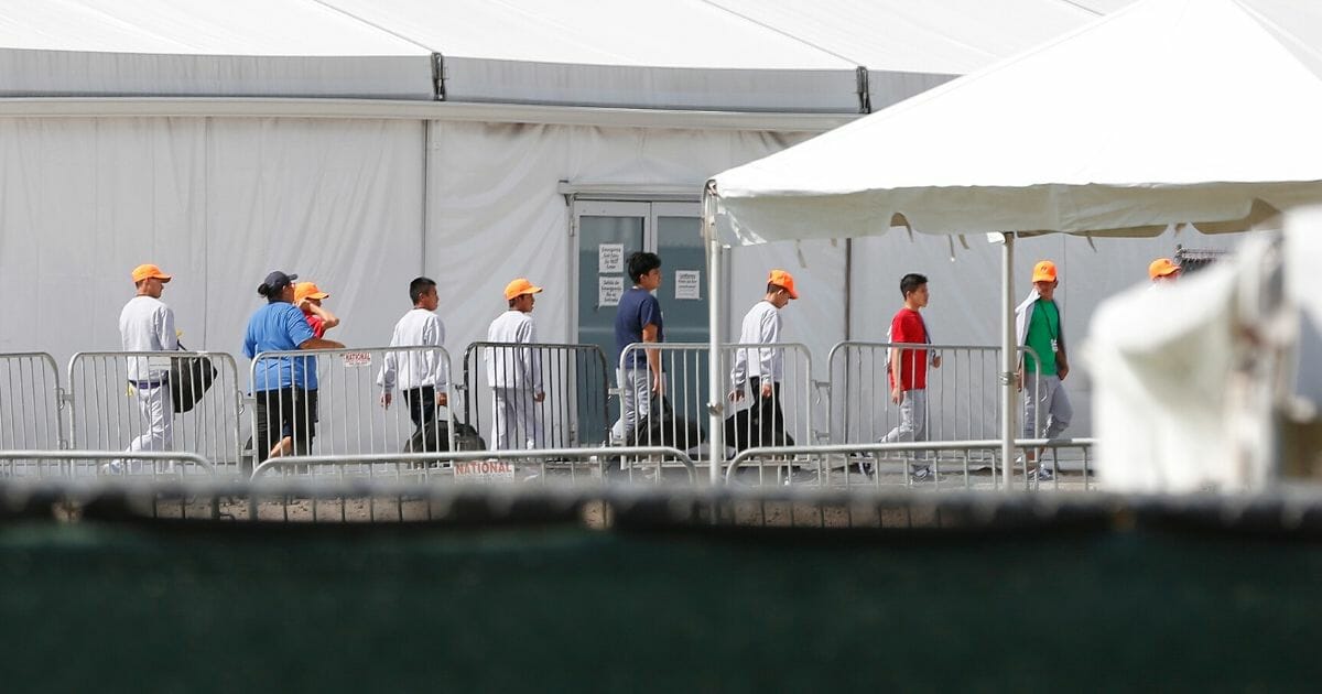 Migrant children who have been separated from their families can be seen in tents at a detention center in Homestead, Florida, on June 27, 2019.