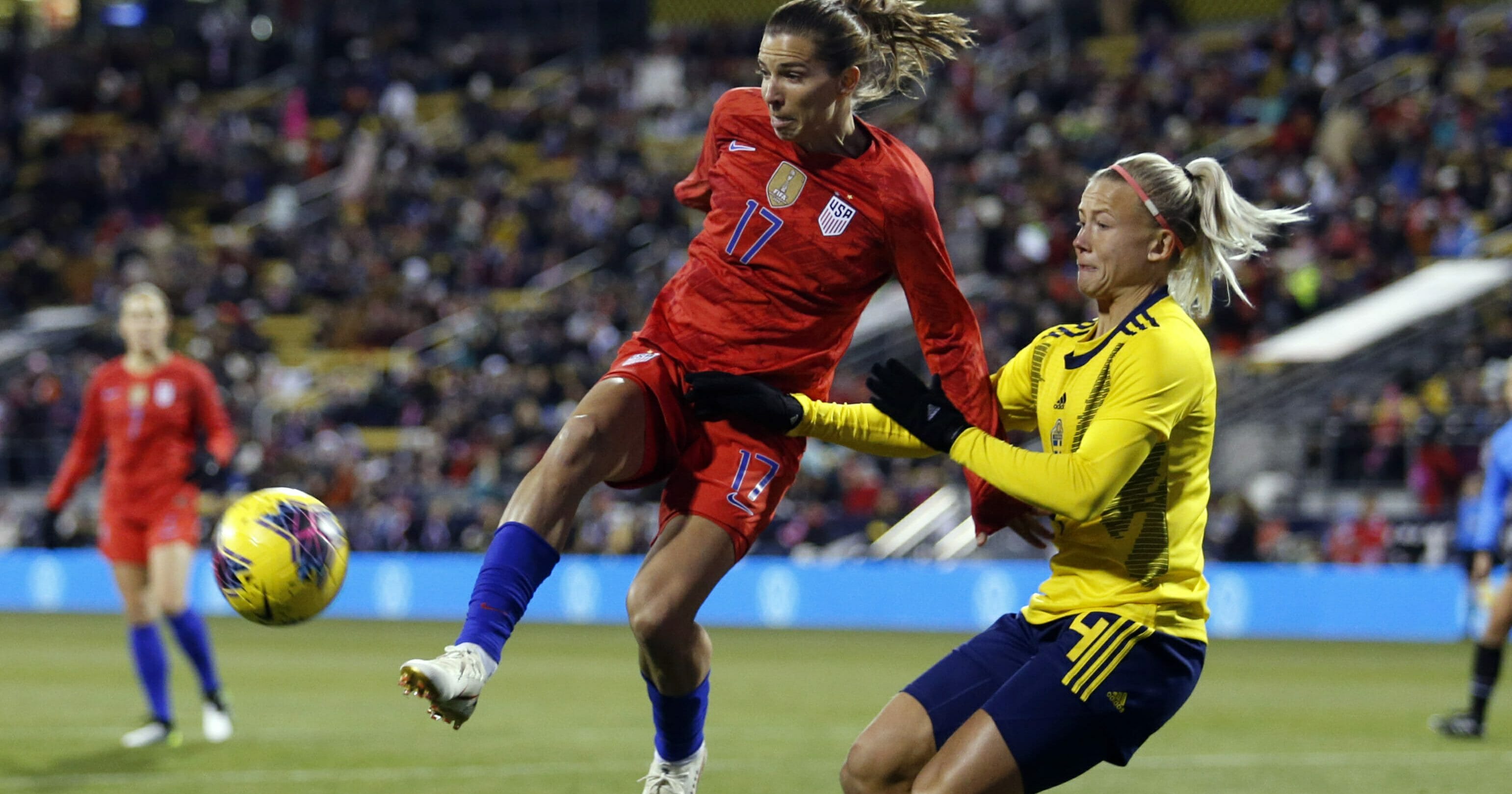 United States forward Tobin Heath, left, passes the ball in front of Sweden defender Hanna Glas during the first half of a women's international friendly soccer match in Columbus, Ohio, on Nov. 7, 2019.